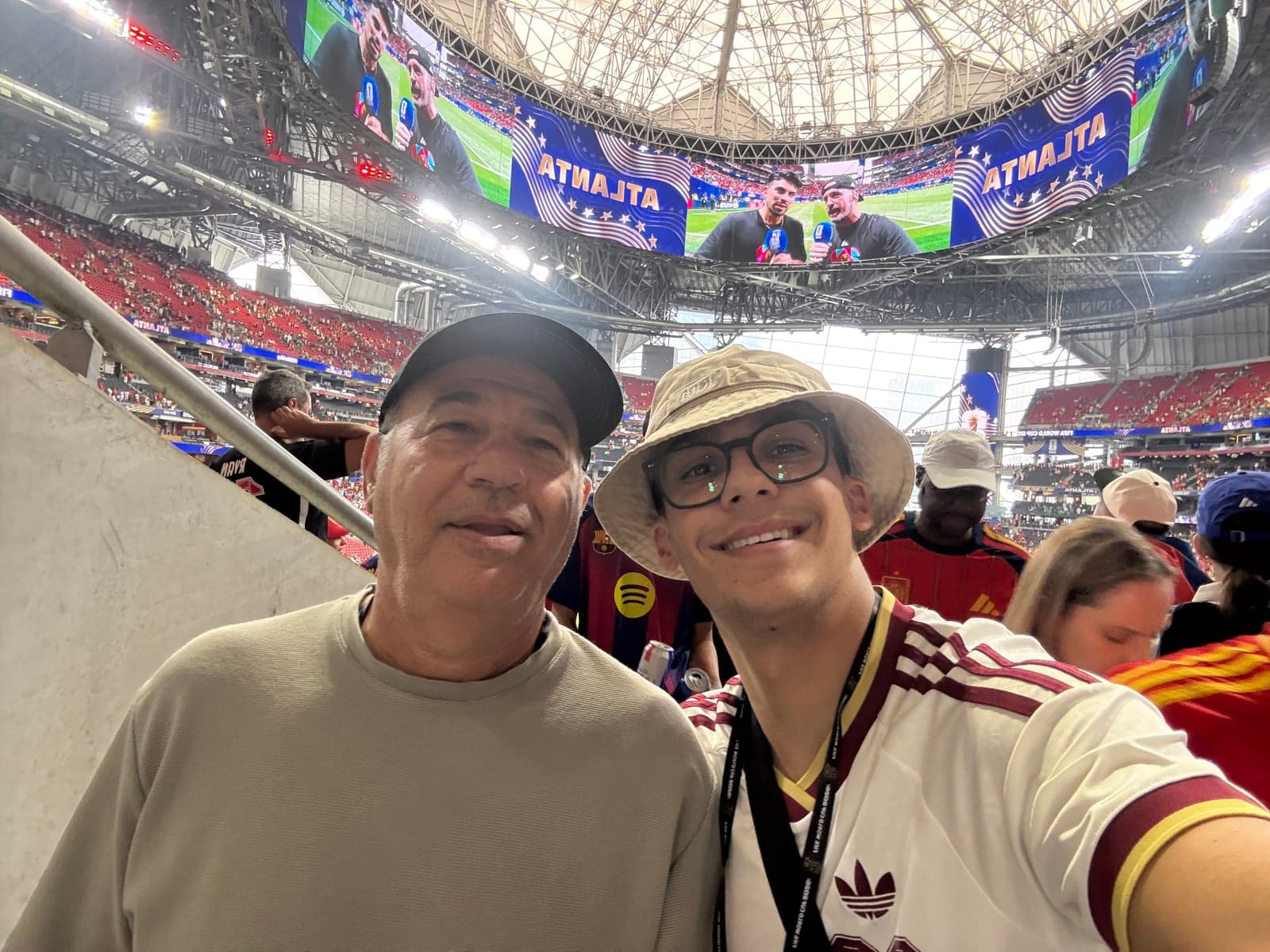 Ely and his dad at a 2026 FIFA World Cup match in Atlanta.